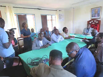 REDESO project coordinator briefing Hon. Brig. Emmanuel Maganga, The Kigoma Regional commissioner prior to launching tree planting