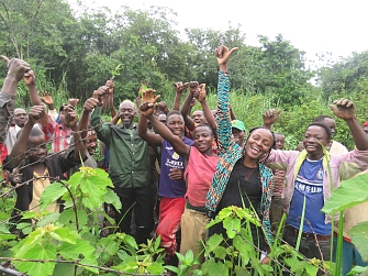 Kakonko DED, Mr. Ludubila Mwakibibi in a photo with community members after finishing mass tree planting exercise in Kakonko District.