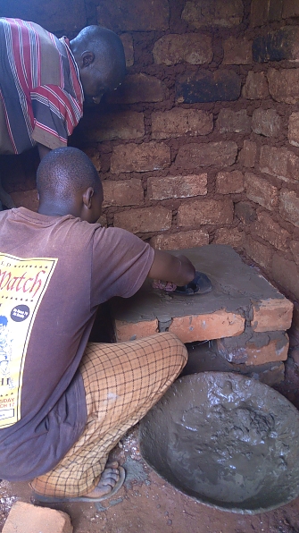 Installing insert stove at Nduta camp in Kibondo District